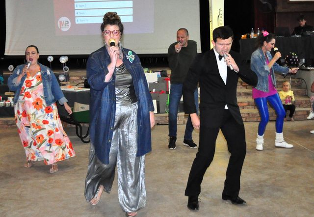 Guests singing and dancing on the floor